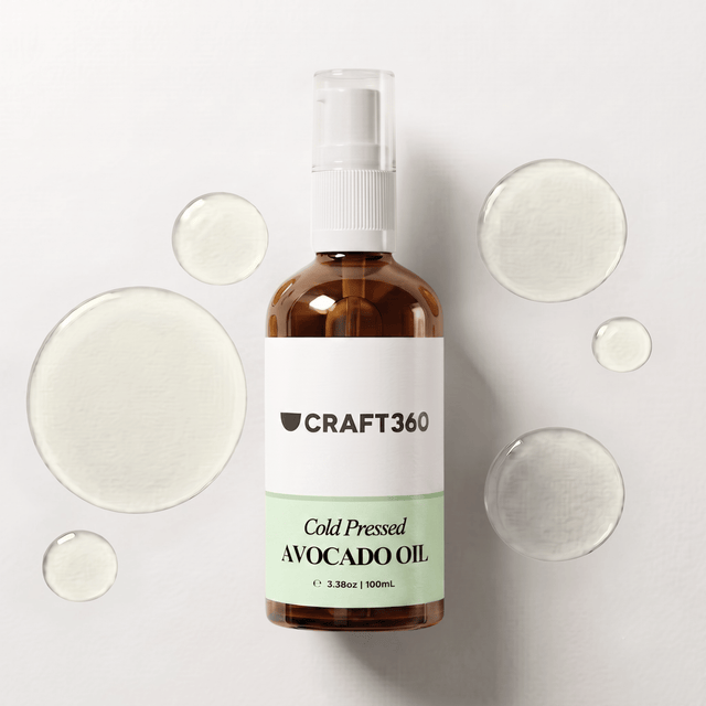 100 ml bottle of Avocado Oil surrounded by pools of natural carrier oil